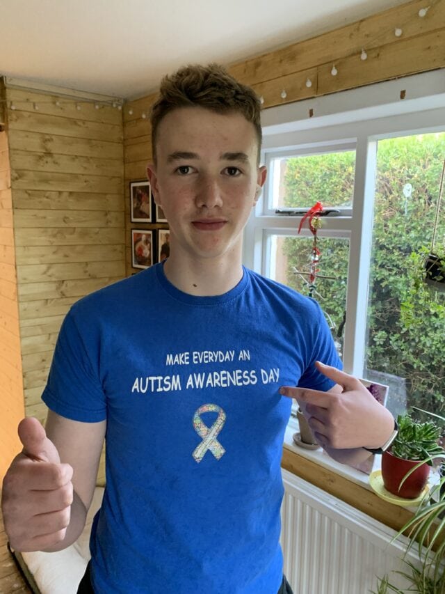 A young adult wearing an Autism t-shirt